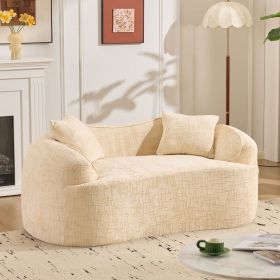 Beige curved two - person compress sofa. It has armrests on both sides, comes with two pillows, is suitable for small - sized apartments